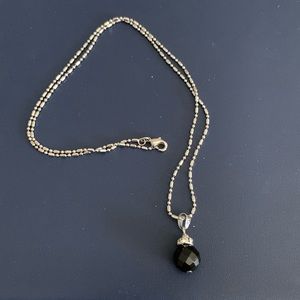 Silver necklace with black bead